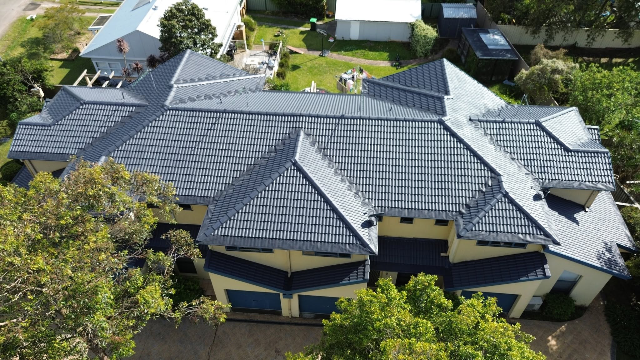 Charcoal tile roof restored and re-coated on a Hunter region home