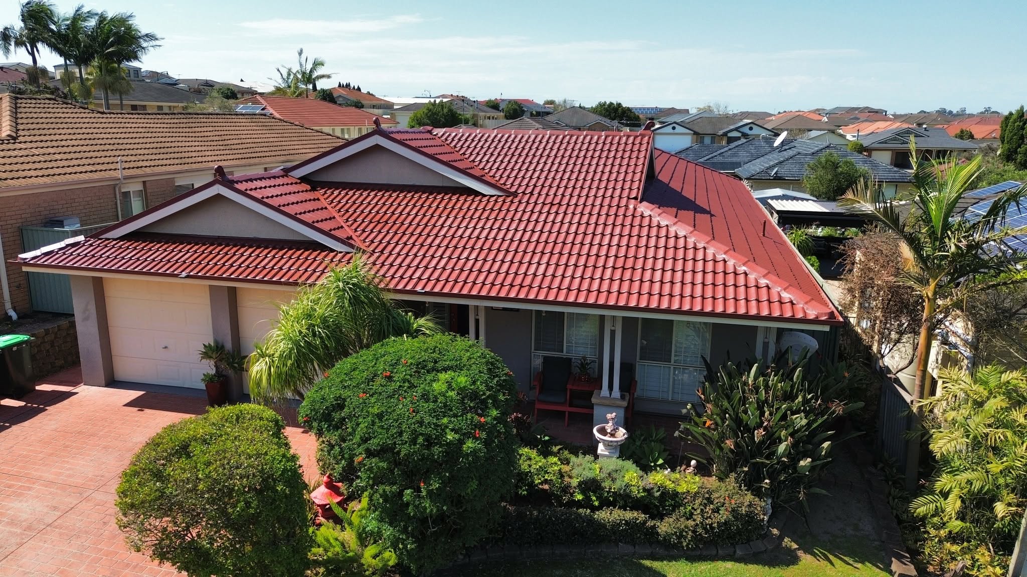 Red tile roof repaired and re-bedded on a Newcastle home